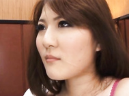 sexy Momoka Nishina rubs one of the guys cock through his trousers with her foot.