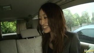 Yuu Kanda Asian babe is in the car with black stockings.